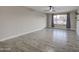 Bright living room featuring modern light fixtures, stylish flooring and neutral walls at 2122 E Radcliffe Dr, Tempe, AZ 85283