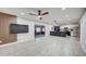 Open-concept living area with modern fixtures, stylish flooring, and seamless flow to the kitchen at 2122 E Radcliffe Dr, Tempe, AZ 85283