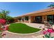 Picturesque backyard with lush artificial turf and inviting covered patio at 21893 N 261St N Ave, Buckeye, AZ 85396