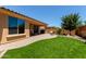 Expansive backyard featuring artificial turf, patio, and outdoor BBQ at 21893 N 261St N Ave, Buckeye, AZ 85396