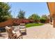 Serene backyard featuring a cozy seating area and lush artificial grass at 21893 N 261St N Ave, Buckeye, AZ 85396