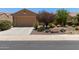 Charming home featuring a neutral color scheme, well-manicured landscaping, and a spacious two-car garage at 21893 N 261St N Ave, Buckeye, AZ 85396