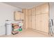 Garage with built-in storage cabinets and sink at 21893 N 261St N Ave, Buckeye, AZ 85396