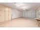 Spacious garage with built-in cabinets and epoxy flooring for ample storage at 21893 N 261St N Ave, Buckeye, AZ 85396