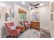 Cozy living room featuring neutral walls, a ceiling fan, and comfortable seating arrangements at 21893 N 261St N Ave, Buckeye, AZ 85396