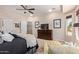 Bright main bedroom with a ceiling fan, dresser, and access to a patio at 21893 N 261St N Ave, Buckeye, AZ 85396