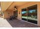 Inviting covered patio with ceiling fan and seamless access to outdoor living at 21893 N 261St N Ave, Buckeye, AZ 85396