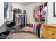 Large walk-in closet with built-in shelving, hanging rods, and ample storage space at 21893 N 261St N Ave, Buckeye, AZ 85396
