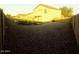 This backyard features rocks with a section for grass in the back at 22523 W Pima St, Buckeye, AZ 85326