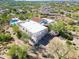 Stunning aerial view of a desert home with a pool and scenic mountain views, surrounded by natural landscaping at 24724 N 119Th Pl, Scottsdale, AZ 85255