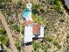 Overhead view of the desert home showcasing the pool, tile roof, desert landscaping, and hardscape at 24724 N 119Th Pl, Scottsdale, AZ 85255