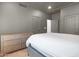 Neutral bedroom with dresser, white linens and neutral walls. and hardwood floors at 24724 N 119Th Pl, Scottsdale, AZ 85255