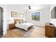 Bright bedroom with hardwood floors, a large window, and neutral walls at 24724 N 119Th Pl, Scottsdale, AZ 85255
