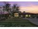 Well-manicured yard of a desert home featuring a stucco exterior, a tile roof, and views of the sunset at 24724 N 119Th Pl, Scottsdale, AZ 85255