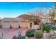 Charming home with desert landscaping, brick driveway, three car garage, and mountain views at 24724 N 119Th Pl, Scottsdale, AZ 85255