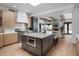Spacious kitchen with a large island, modern appliances, and seamless flow to the living area at 24724 N 119Th Pl, Scottsdale, AZ 85255