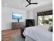 Comfortable main bedroom with a fireplace and a large glass slider to the backyard at 24724 N 119Th Pl, Scottsdale, AZ 85255