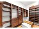 Spacious walk-in closet with built-in shelving and drawers at 24724 N 119Th Pl, Scottsdale, AZ 85255