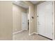 A cozy entryway with tile flooring and a white door, offering a warm welcome at 25969 W Tina Ln, Buckeye, AZ 85396