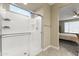 Bright bathroom featuring a glass shower with tile flooring at 25969 W Tina Ln, Buckeye, AZ 85396