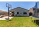 This backyard has a patio, basketball hoop, and trampoline at 37287 N Azteca Rd, San Tan Valley, AZ 85140