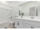 Bright bathroom featuring a double sink vanity and a shower-tub combo at 37287 N Azteca Rd, San Tan Valley, AZ 85140