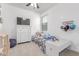 Bright bedroom featuring a ceiling fan, white dresser, and decorative accents at 37287 N Azteca Rd, San Tan Valley, AZ 85140