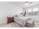 Cozy bedroom with neutral tones, ceiling fan and carpet flooring at 37287 N Azteca Rd, San Tan Valley, AZ 85140