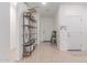 Bright hallway featuring neutral paint, decorative shelving, and a tile floor that flows seamlessly at 37287 N Azteca Rd, San Tan Valley, AZ 85140