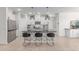 Modern kitchen featuring stainless steel appliances, a center island, and white cabinets at 37287 N Azteca Rd, San Tan Valley, AZ 85140