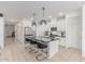 Open kitchen featuring a large island with seating, stainless steel appliances, and sleek countertops at 37287 N Azteca Rd, San Tan Valley, AZ 85140