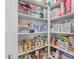 Walk-in pantry with ample shelving and storage space, perfect for keeping organized at 37287 N Azteca Rd, San Tan Valley, AZ 85140