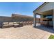 Inviting outdoor patio featuring comfortable seating, a swing, and string lights at 37287 N Azteca Rd, San Tan Valley, AZ 85140