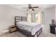 Bright bedroom with a ceiling fan, large windows, and a comfortable bed, perfect for relaxation at 3821 N 125Th Dr, Avondale, AZ 85392