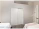 The bedroom has twin beds, sliding door closet and plush carpet at 3821 N 125Th Dr, Avondale, AZ 85392