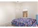 Bright bedroom with a twin bed, carpet and neutral walls at 3821 N 125Th Dr, Avondale, AZ 85392