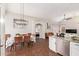 A cozy dining area with a chandelier and doorway to a bedroom and sitting area at 3821 N 125Th Dr, Avondale, AZ 85392