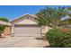 Charming home featuring a two-car garage, well-maintained landscaping, and a welcoming entrance at 3821 N 125Th Dr, Avondale, AZ 85392