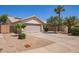 Charming single-story home with desert landscaping, a two-car garage, and a serene neighborhood setting at 3821 N 125Th Dr, Avondale, AZ 85392