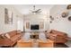 Spacious living room with vaulted ceilings, two sofas, two chairs and modern decor at 3821 N 125Th Dr, Avondale, AZ 85392