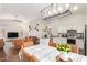 Open-concept living space featuring a kitchen with stainless steel appliances and a connected dining and living area at 3821 N 125Th Dr, Avondale, AZ 85392