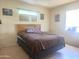 Bedroom with a queen size bed and light wood laminate flooring at 4030 N 33Rd Pl, Phoenix, AZ 85018