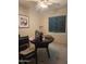 Cozy dining area with a round table, chairs, and a window for natural light at 4030 N 33Rd Pl, Phoenix, AZ 85018