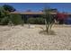 A charming home features a well-kept front yard with easy-care desert landscaping with stone ground cover at 4030 N 33Rd Pl, Phoenix, AZ 85018