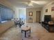 Bright living room with tile floors, ceiling fan, and a television at 4030 N 33Rd Pl, Phoenix, AZ 85018