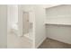 Bright bathroom featuring a tub, shower, tile floor, and walk in closet at 4035 S 176Th Dr, Goodyear, AZ 85338