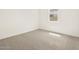 Bedroom with neutral carpet, light walls, and window with blinds at 4035 S 176Th Dr, Goodyear, AZ 85338