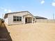 The backyard and exterior of a modern home with desert landscaping at 4035 S 176Th Dr, Goodyear, AZ 85338