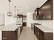 Spacious kitchen featuring dark cabinets, stainless steel appliances, and granite countertops at 4035 S 176Th Dr, Goodyear, AZ 85338