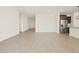 Open-concept living room boasting light wood-look flooring and ample natural light at 4035 S 176Th Dr, Goodyear, AZ 85338
